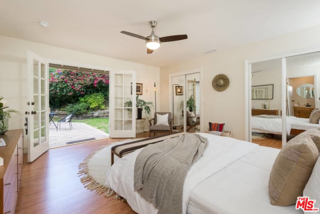 5712 Tellefson Road Culver City, CA 90230 - Photo 18 of 25 a spacious bedroom with a large bed and a large window