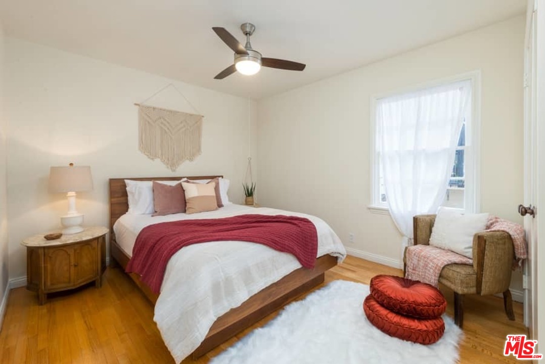 5712 Tellefson Road Culver City, CA 90230 - Photo 20 of 25 a bedroom with bed and a large window