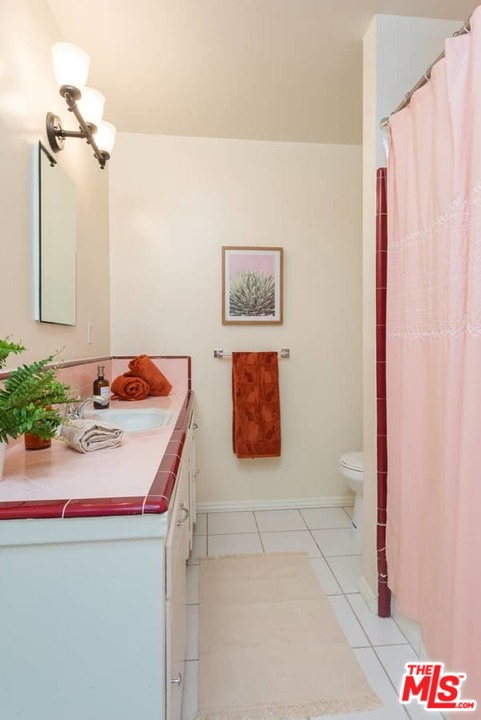5712 Tellefson Road Culver City, CA 90230 - Photo 21 of 25 a bathroom with a sink and a mirror