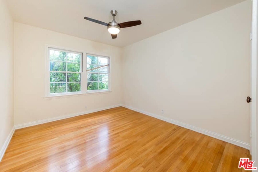 5712 Tellefson Road Culver City, CA 90230 - Photo 22 of 25 an empty room with a window and a fan