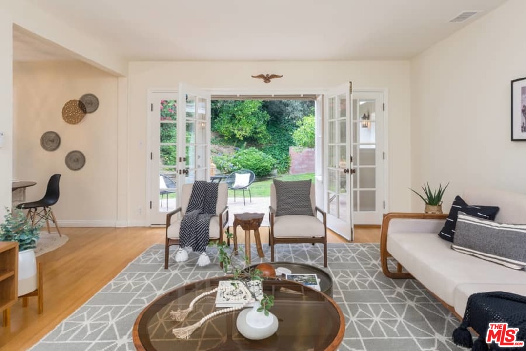 5712 Tellefson Road Culver City, CA 90230 - Photo 4 of 25 a living room with furniture and wooden floor