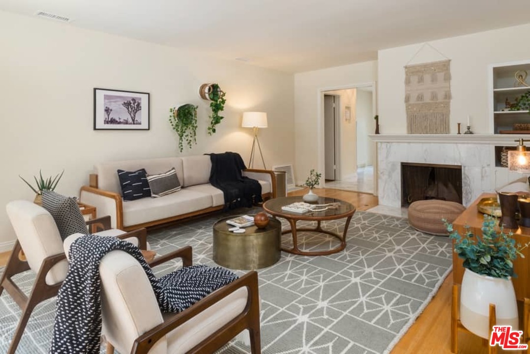 5712 Tellefson Road Culver City, CA 90230 - Photo 5 of 25 a living room with furniture fireplace and rug