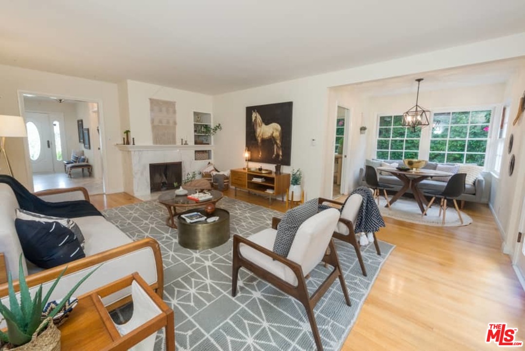 5712 Tellefson Road Culver City, CA 90230 - Photo 7 of 25 a living room with fireplace furniture and a large window