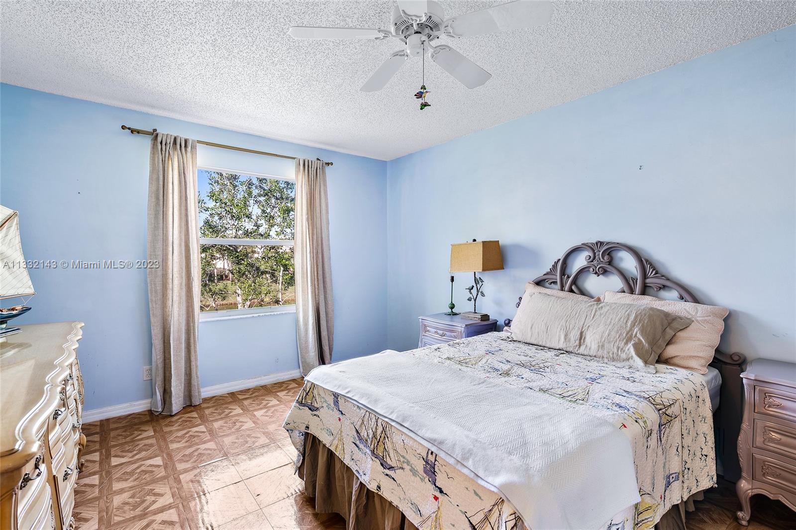 232 Timberwalk Trail Jupiter, FL 33458 - Photo 11 of 33 a bedroom with a bed and a window