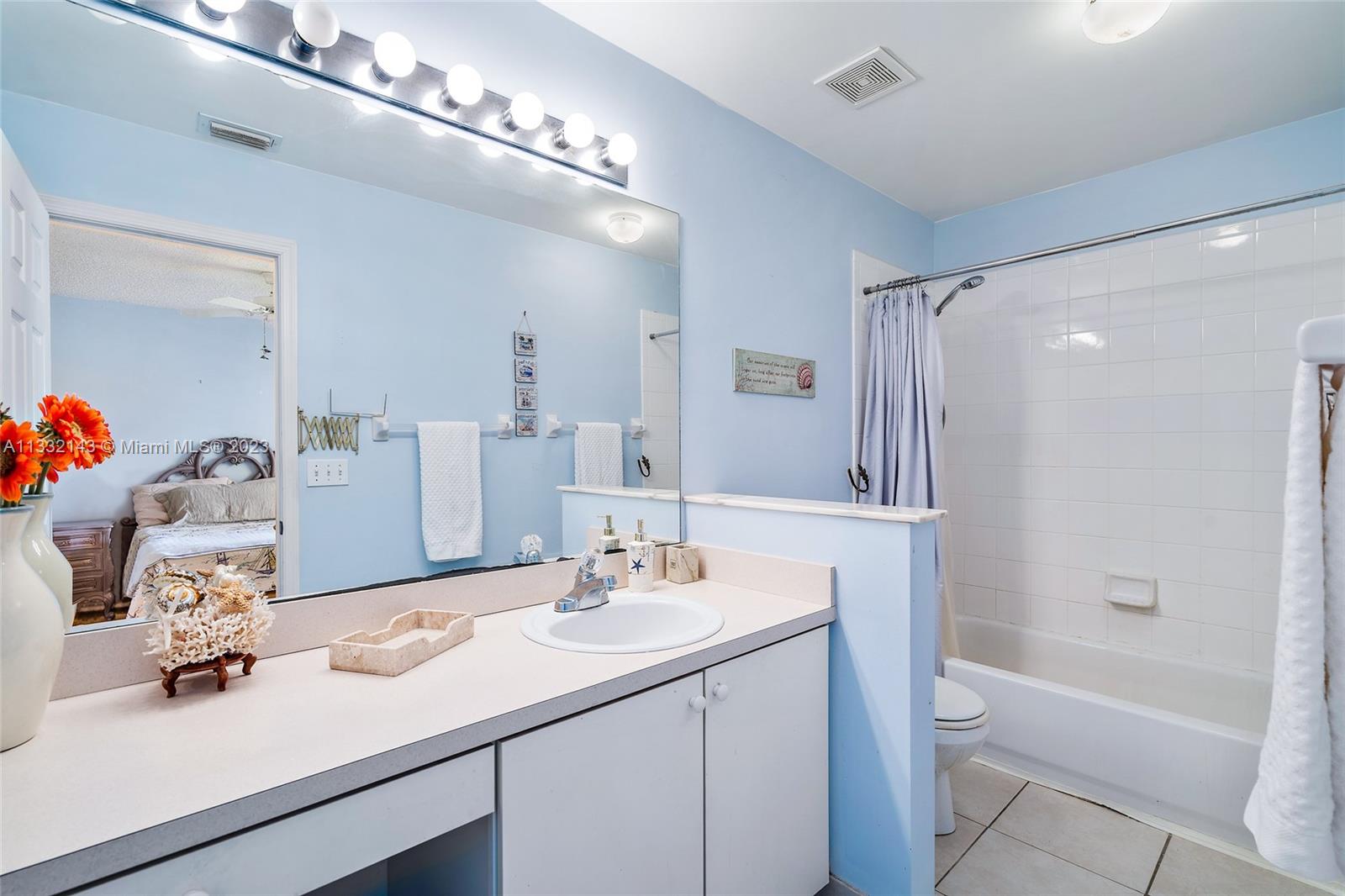 232 Timberwalk Trail Jupiter, FL 33458 - Photo 14 of 33 a bathroom with a sink double vanity granite tub shower and a mirror