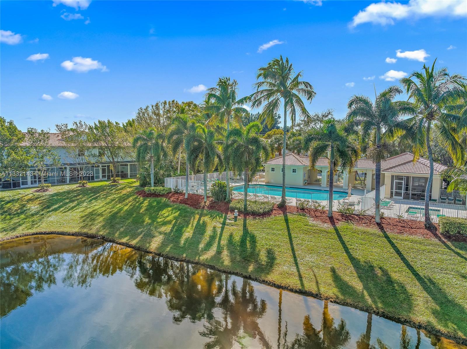 232 Timberwalk Trail Jupiter, FL 33458 - Photo 26 of 33 a view of an outdoor space and swimming pool
