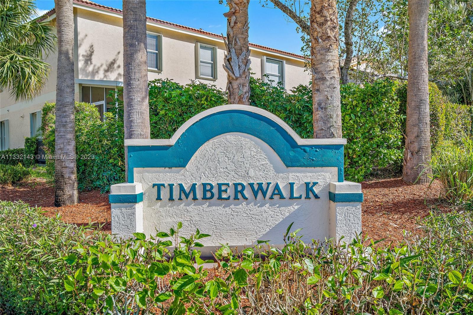 232 Timberwalk Trail Jupiter, FL 33458 - Photo 30 of 33 front view of a house with a garden
