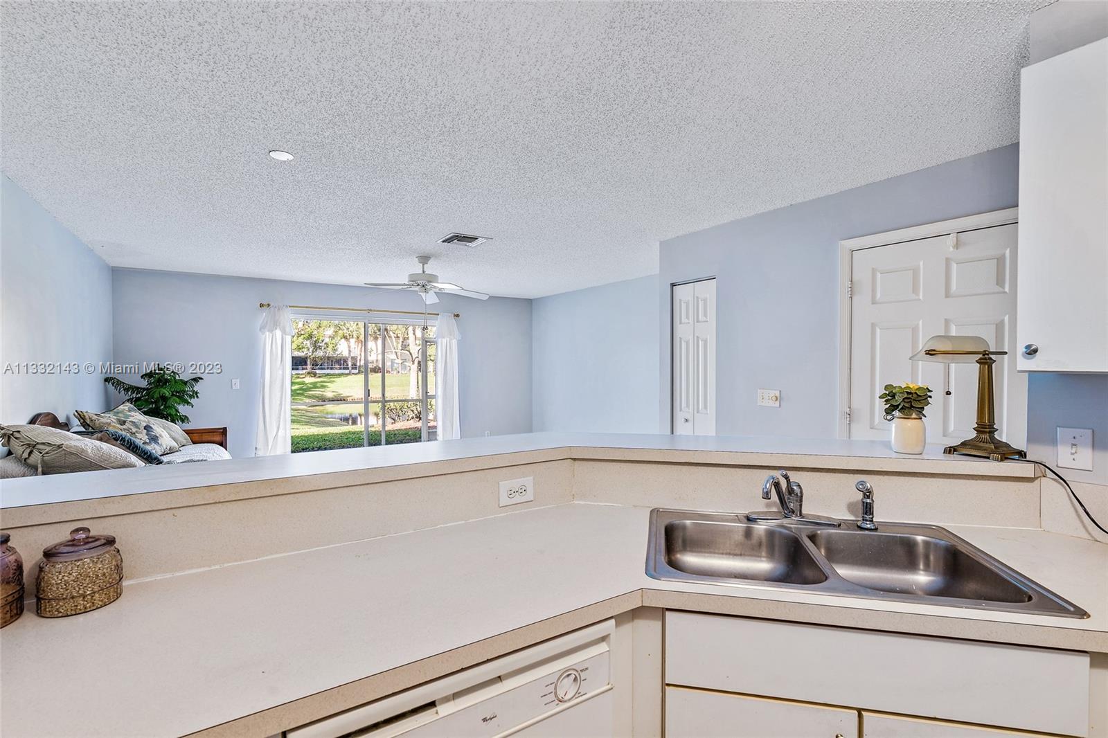 232 Timberwalk Trail Jupiter, FL 33458 - Photo 6 of 33 a kitchen with a sink and a window