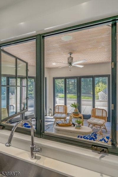 60 Fernwood Road Summit, NJ 07901 - Photo 16 of 50 a living room with furniture and floor to ceiling windows