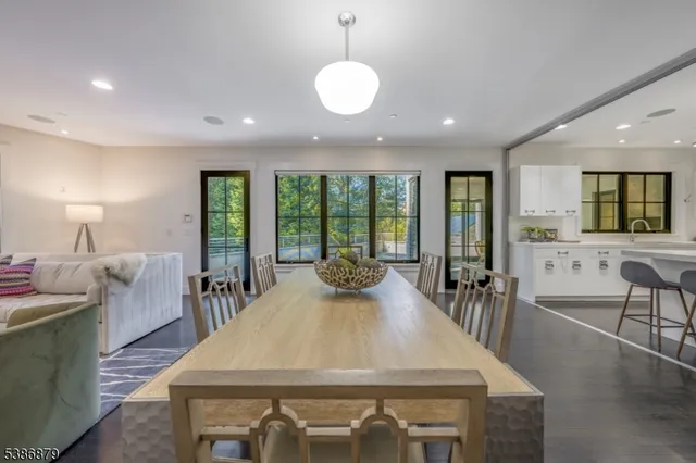 a large kitchen with a table and chairs