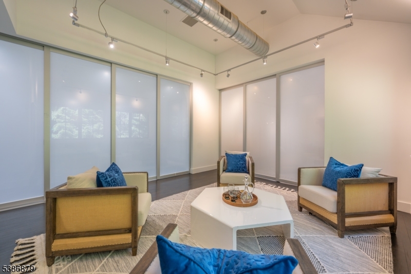 60 Fernwood Road Summit, NJ 07901 - Photo 25 of 50 a living room with furniture and a wooden floor