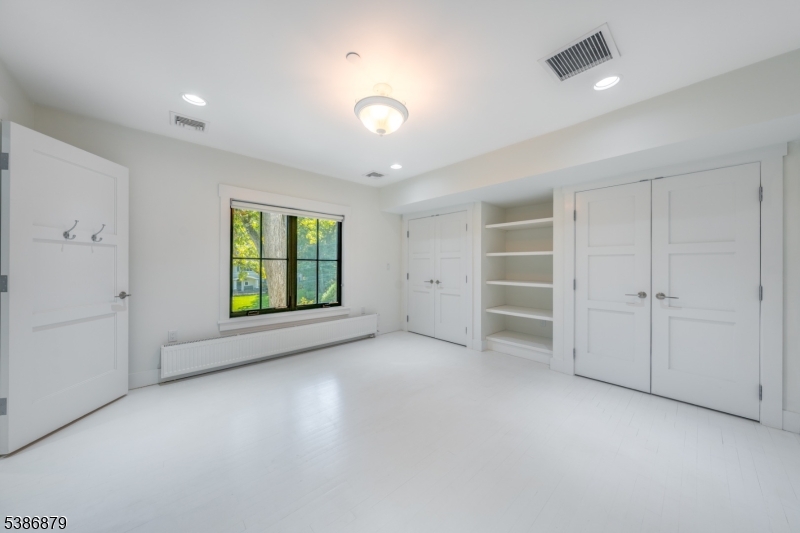 60 Fernwood Road Summit, NJ 07901 - Photo 34 of 50 wooden floor in an empty room with a window