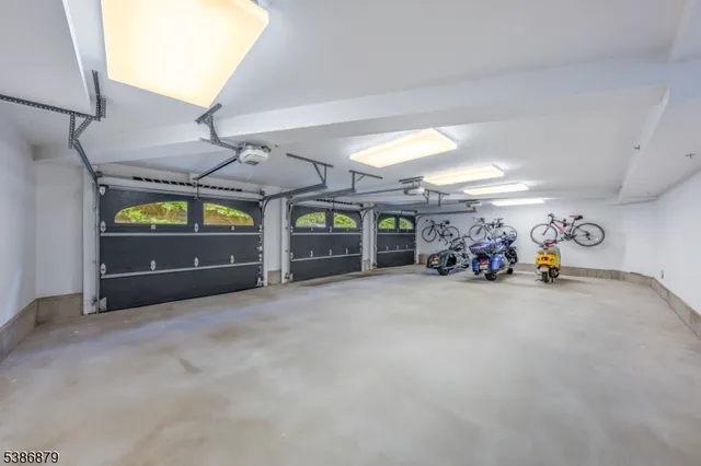 a view of a garage with parked cars