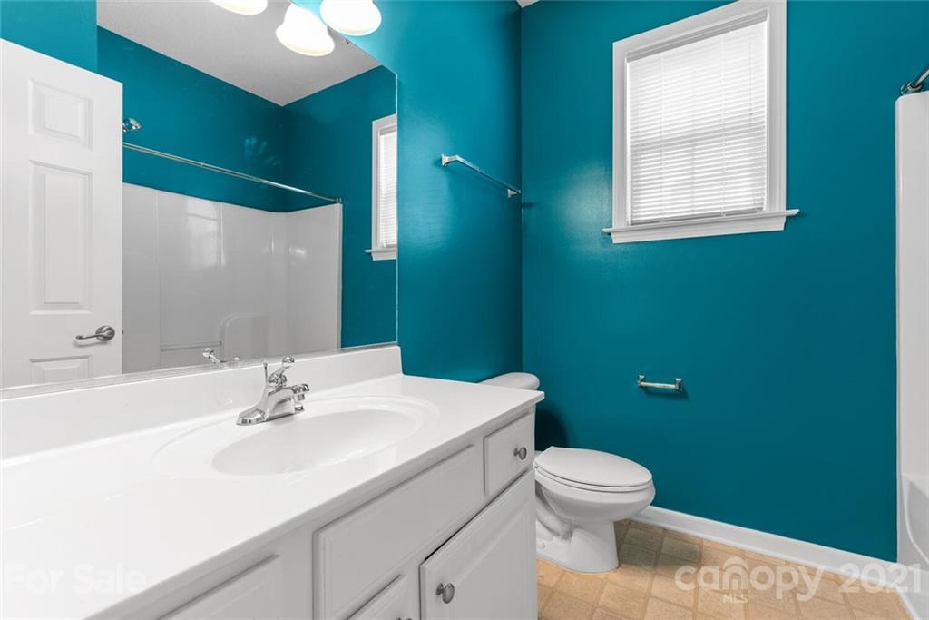 88 Pamlico Road Fletcher, NC 28732 - Photo 22 of 26 a bathroom with a sink toilet and a mirror