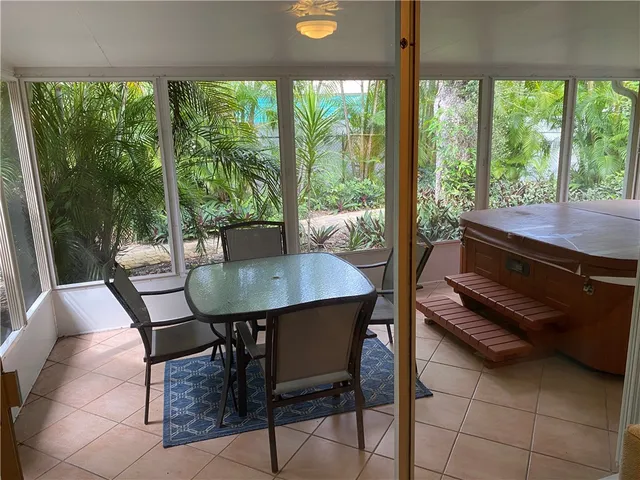 a view of a dining room with furniture and window