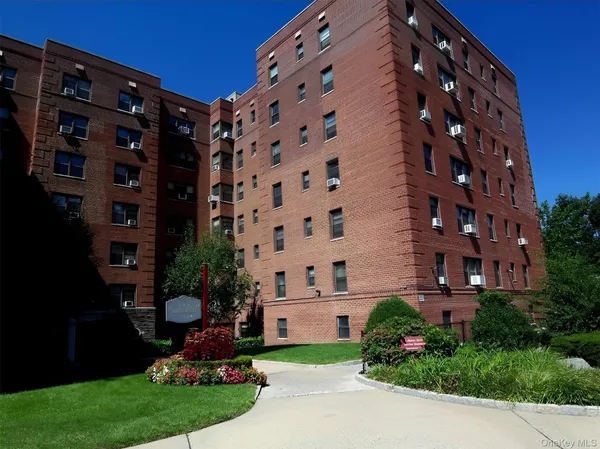 a view of a building with a yard