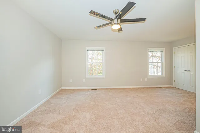 an empty room with fan