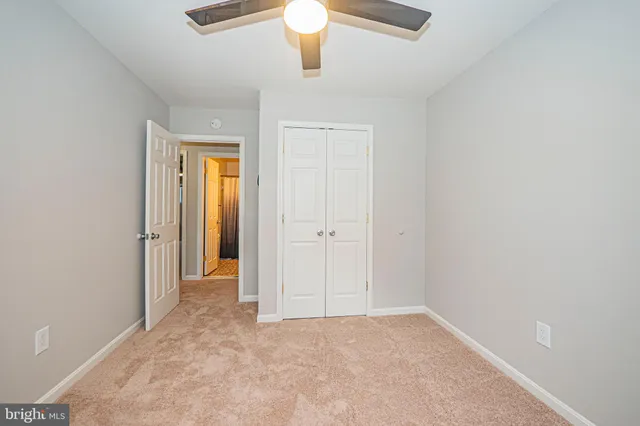 a bathroom with a sink a toilet a mirror and shower