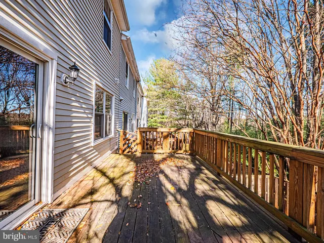 a view of a house with wooden deck