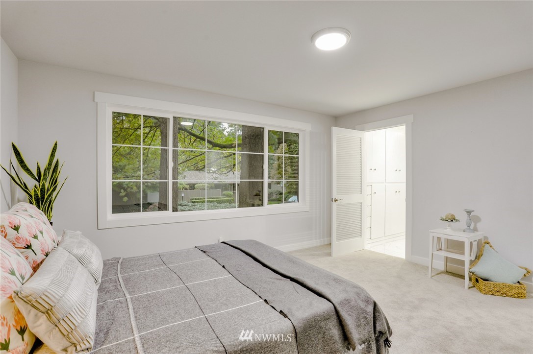13534 Sherman Road Northwest Seattle, WA 98177 - Photo 14 of 20 a bedroom with a bed and a window