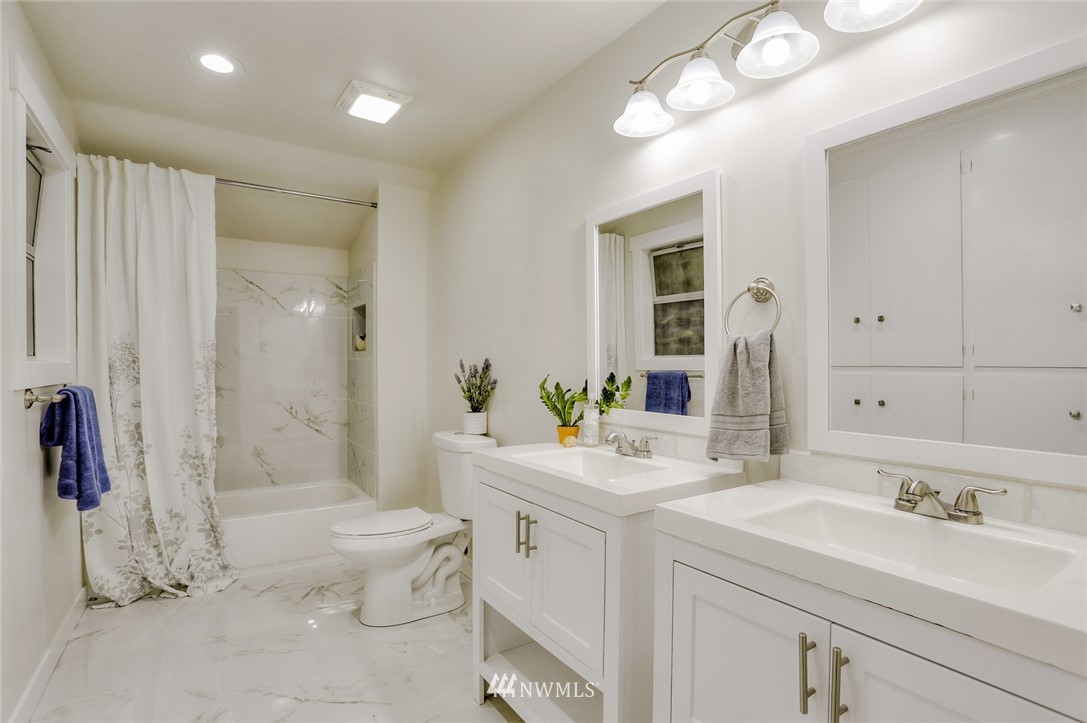 13534 Sherman Road Northwest Seattle, WA 98177 - Photo 15 of 20 a bathroom with a sink a toilet and shower