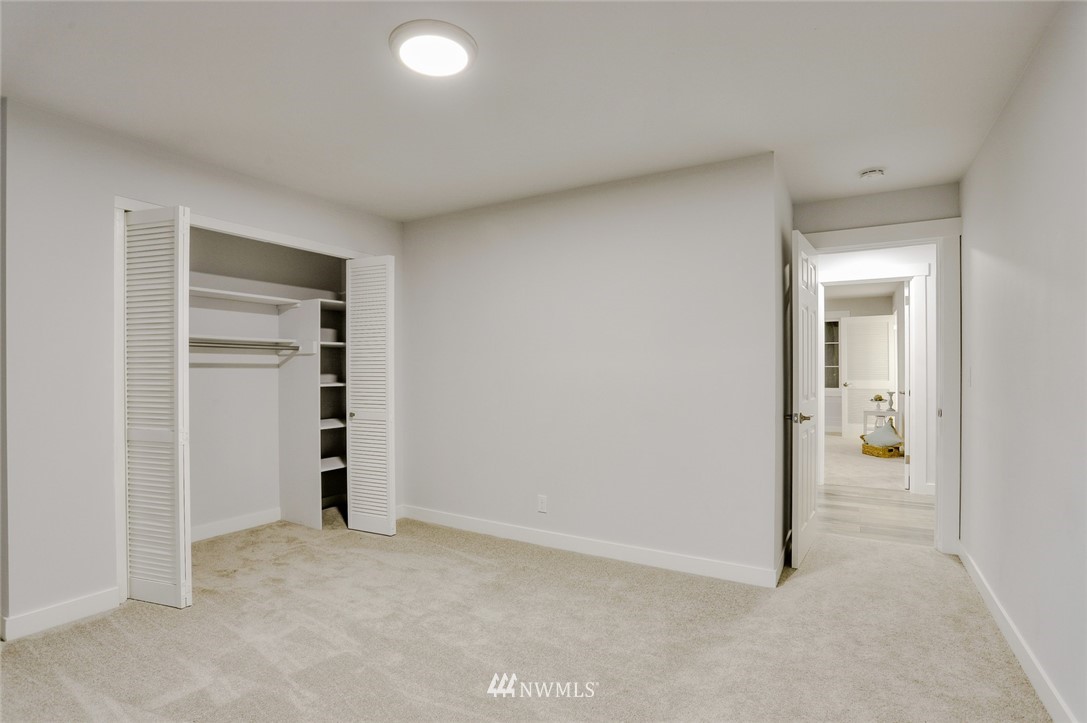 13534 Sherman Road Northwest Seattle, WA 98177 - Photo 17 of 20 an empty room with closet and a bathroom