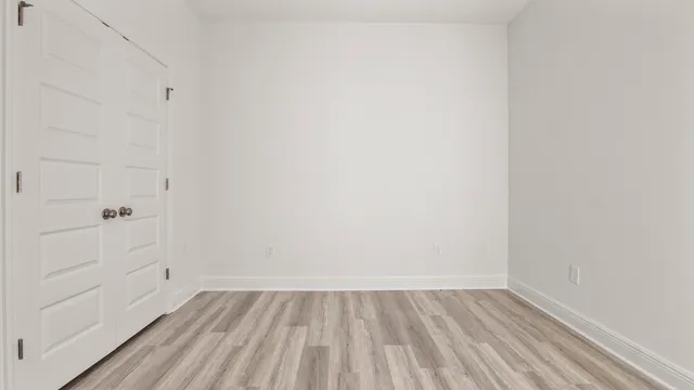 a view of kitchen with wooden floor and window