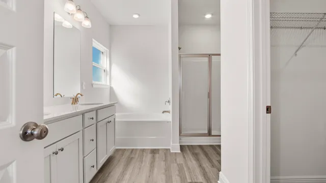 a white bath tub sitting next to a white sink