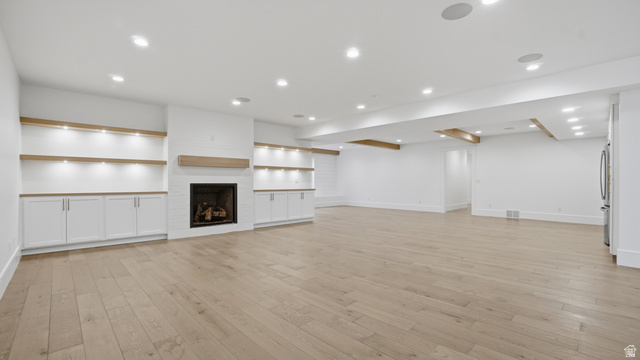 1682 North 1950 W Street, Unit 9 Provo, UT 84604 - Photo 44 of 84 Spacious room featuring wood-finish flooring, recessed lighting, and white walls