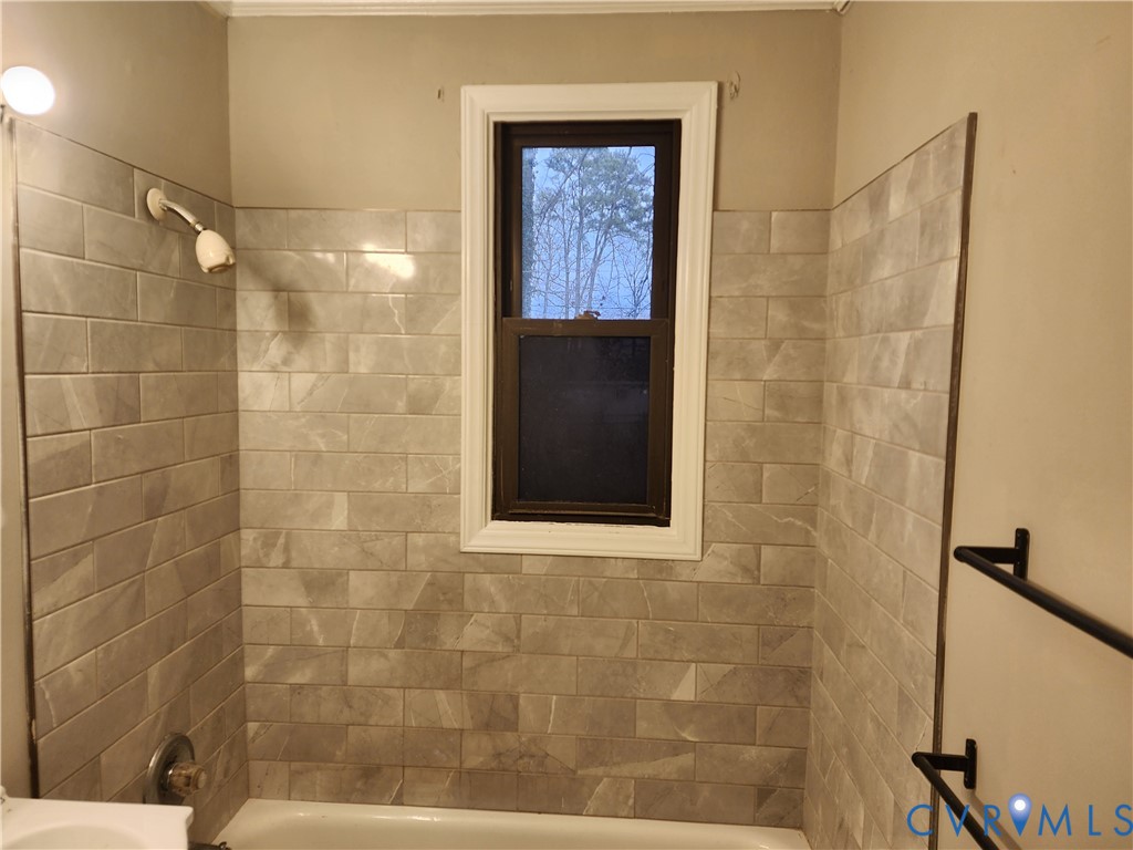 3005 Collins Road Richmond, VA 23223 - Photo 5 of 7 a bathroom with a shower and a sink