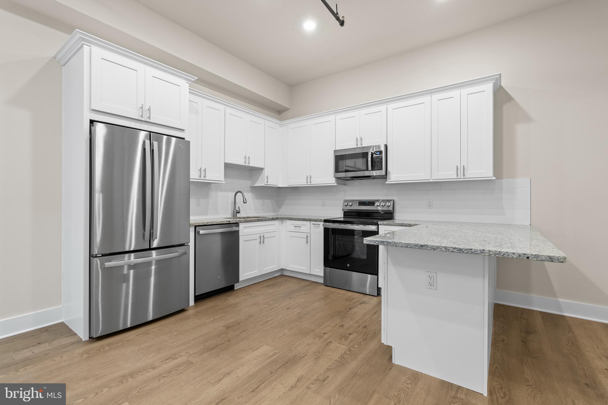 30 West Broad Street Souderton, PA 18964 - Photo 17 of 34 a kitchen with a refrigerator stove top oven and sink