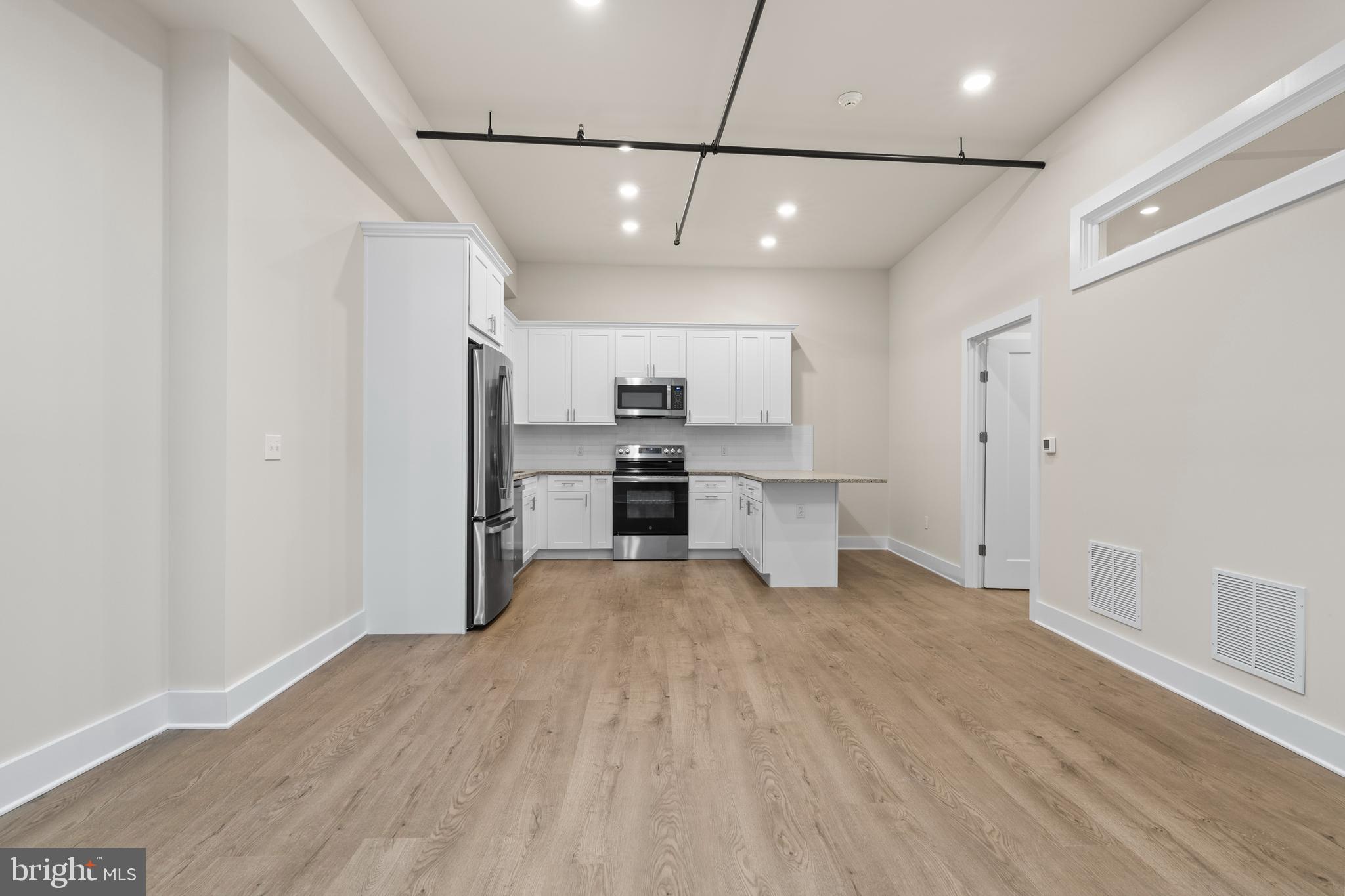 30 West Broad Street Souderton, PA 18964 - Photo 3 of 34 a view of a kitchen with a sink and refrigerator