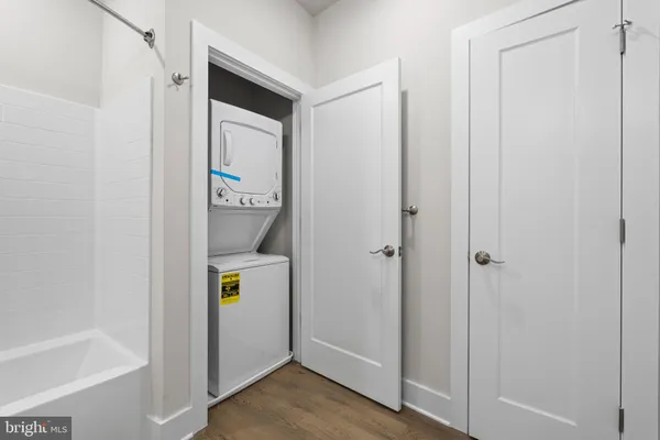 a view of an entryway with wooden floor