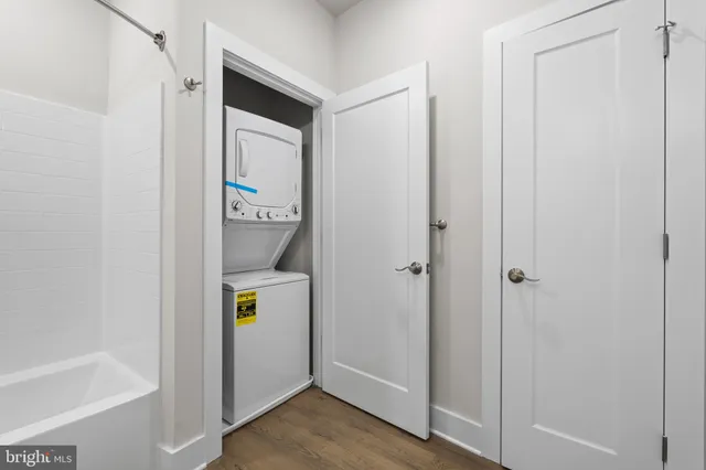 a view of an entryway with wooden floor