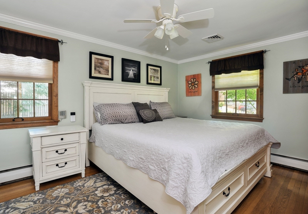 27 Atlantic House Road Hull, MA 02045 - Photo 18 of 30 a bedroom with a large bed and a window