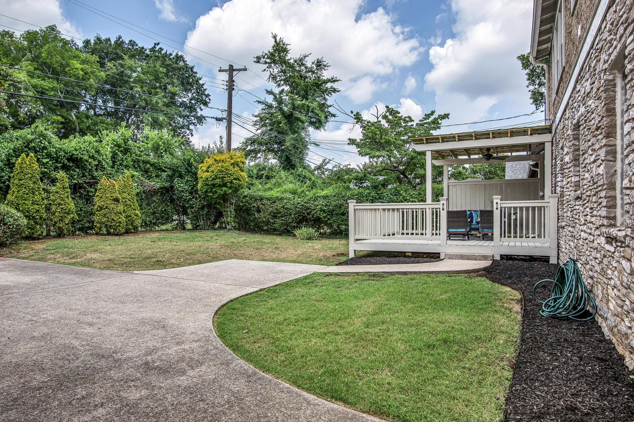 225 Cherokee Road Nashville, TN 37205 - Photo 35 of 47 a view of a house with a yard and sitting area