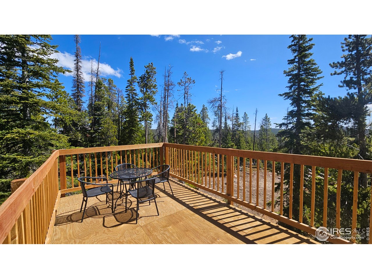 0 Forest Service 169 Road, Unit PARCEL #3 Red Feather Lakes, CO 80545 - Photo 7 of 16 a view of a chairs in a balcony