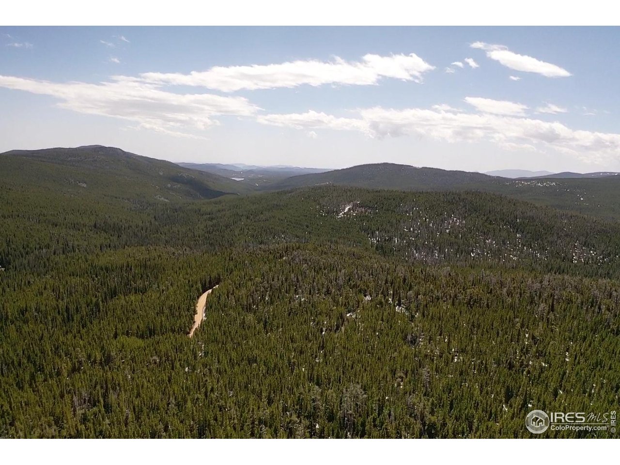 0 Forest Service 169 Road, Unit PARCEL #3 Red Feather Lakes, CO 80545 - Photo 8 of 16 a view of a city with lush green forest