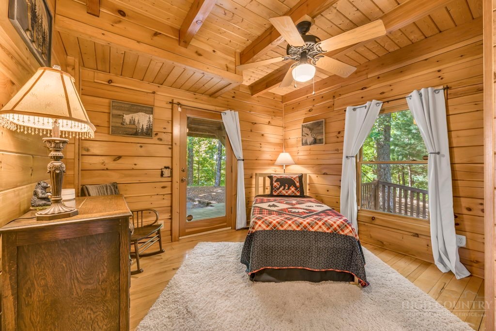 2229 Elk Ridge Road Ferguson, NC 28624 - Photo 21 of 42 a bedroom with a bed and a walk in closet