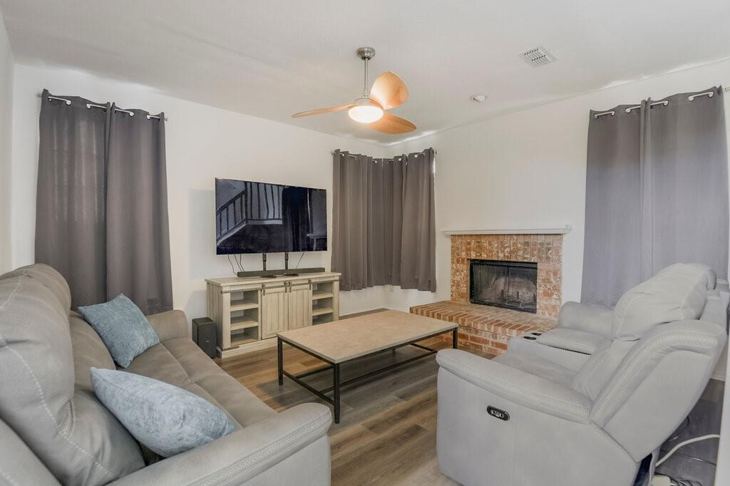 5428 Rolling Green Road Arlington, TX 76017 - Photo 8 of 29 Family room has a wood burning fireplace and is so cozy!