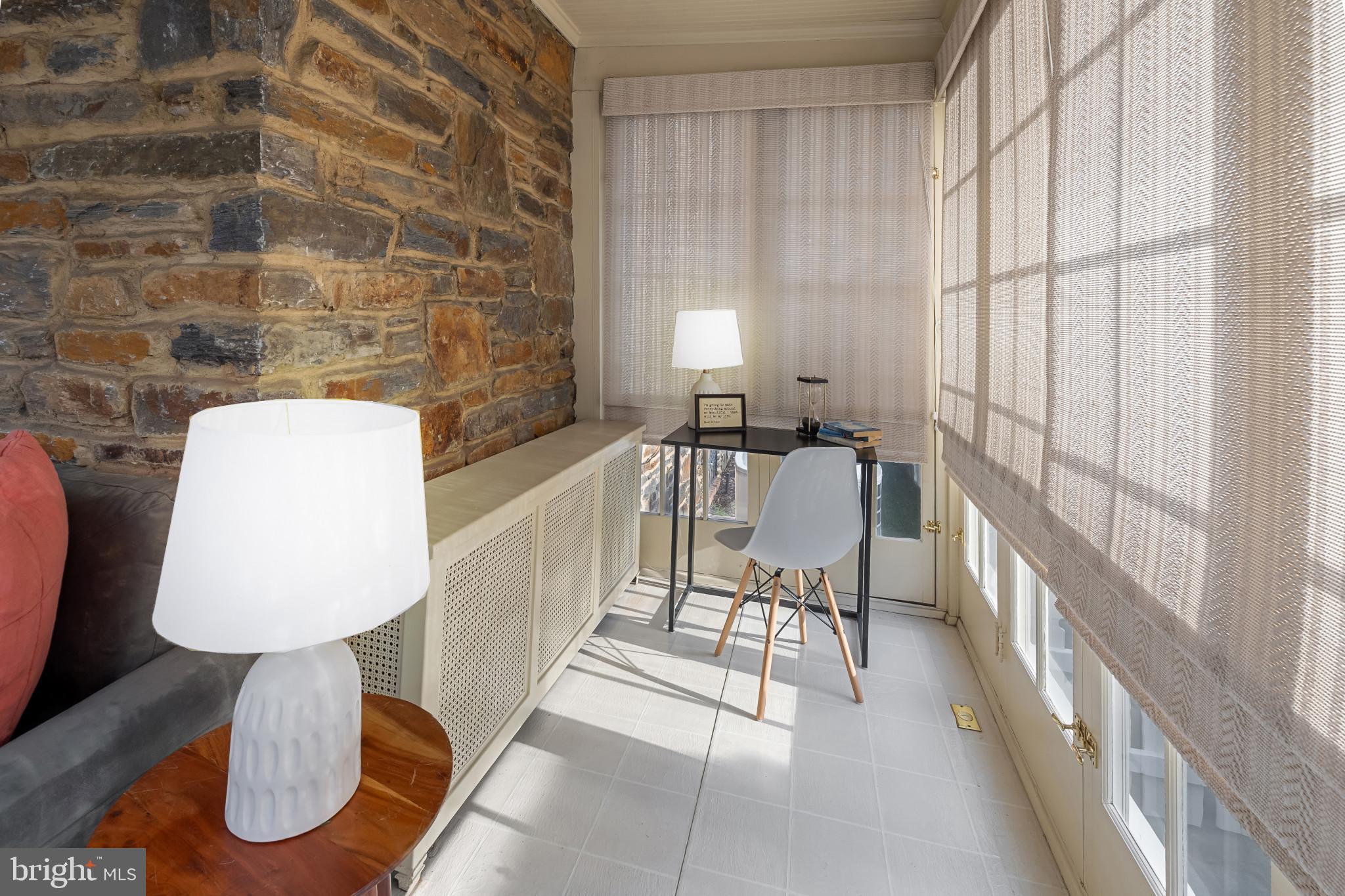 302 Tunbridge Road Baltimore, MD 21212 - Photo 12 of 77 a living room with furniture and a table