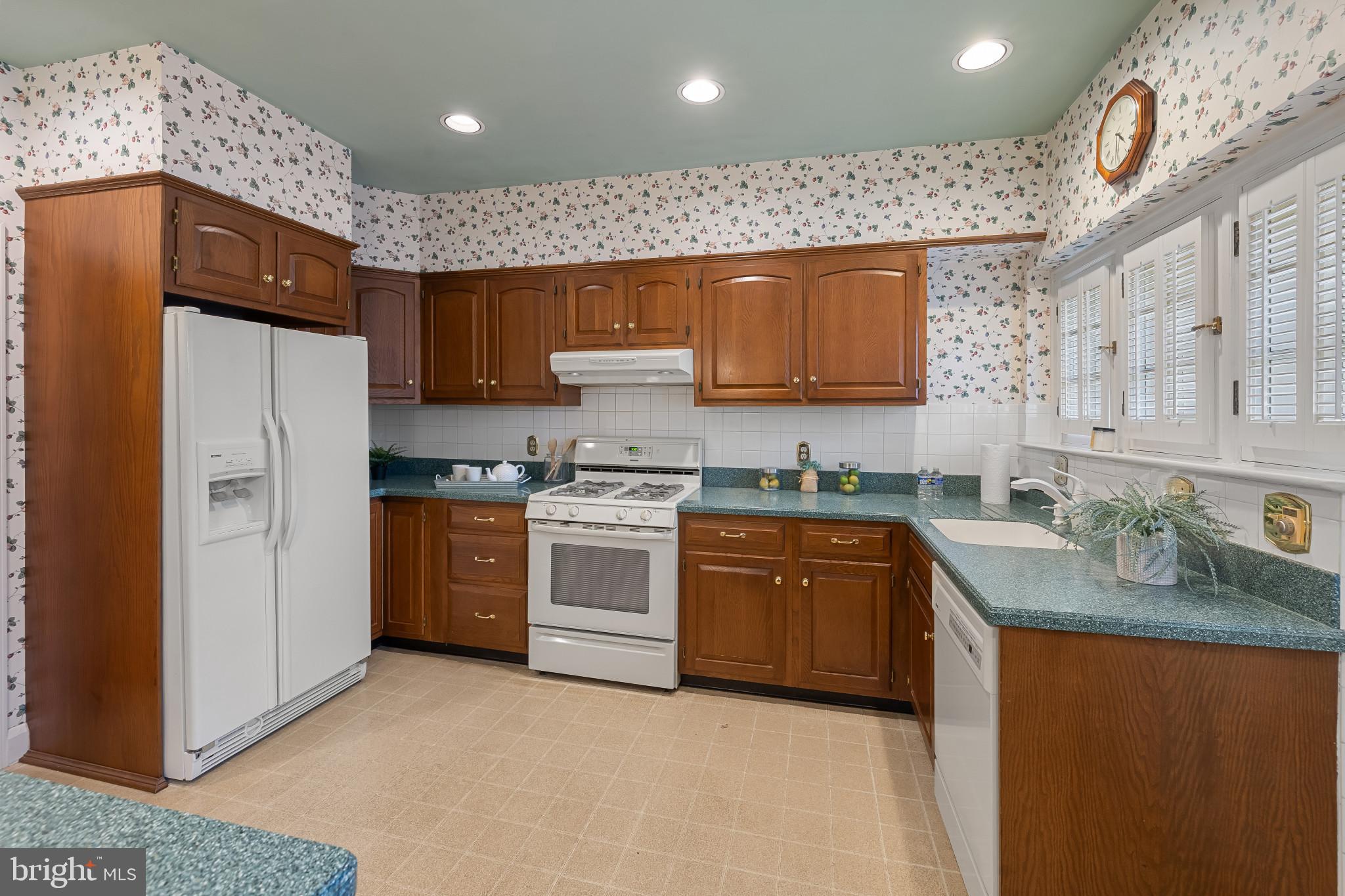 302 Tunbridge Road Baltimore, MD 21212 - Photo 17 of 77 a kitchen with granite countertop a sink stainless steel appliances and cabinets