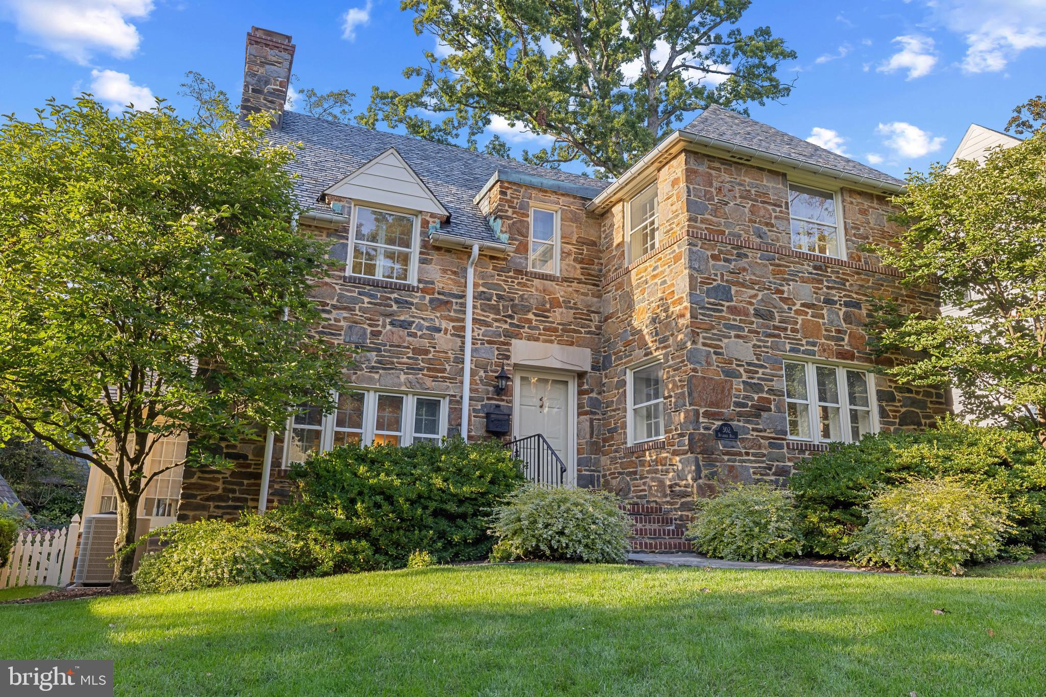 302 Tunbridge Road Baltimore, MD 21212 - Photo 2 of 77 Charming stone residence with lush greenery.