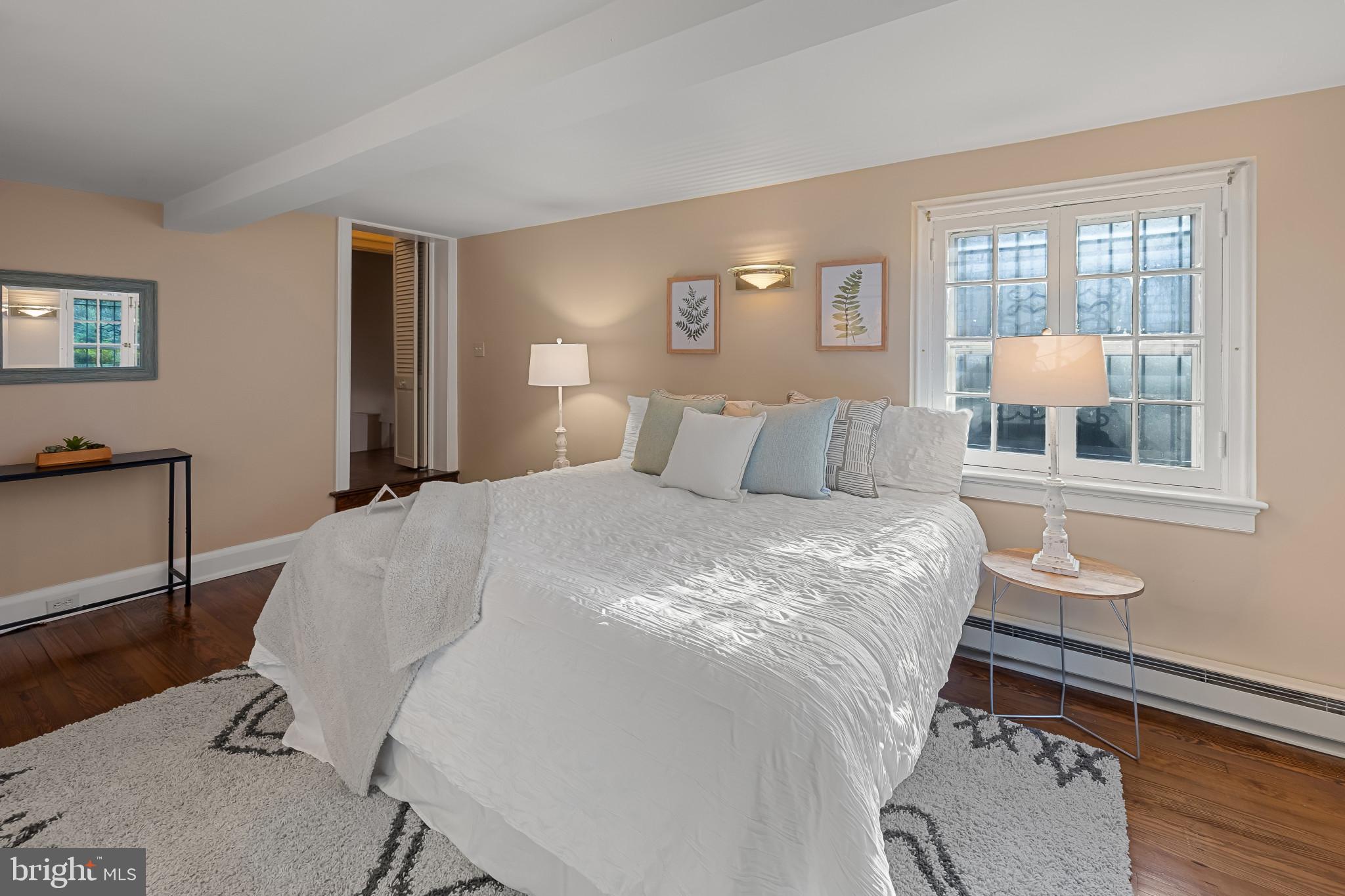 302 Tunbridge Road Baltimore, MD 21212 - Photo 22 of 77 Serene bedroom with natural light and warmth.
