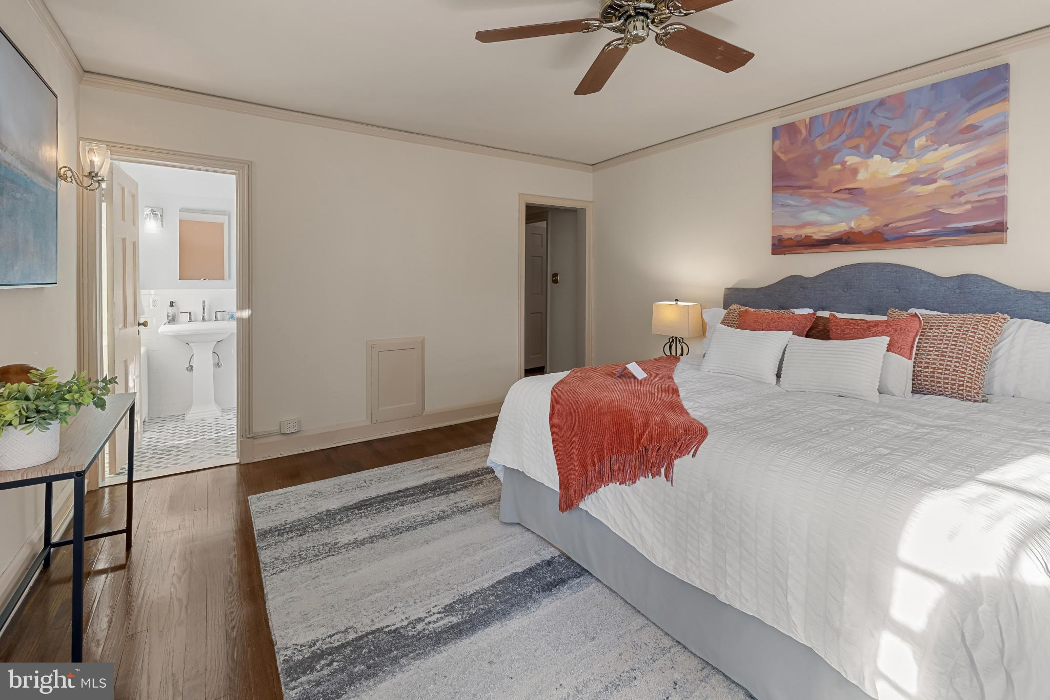 302 Tunbridge Road Baltimore, MD 21212 - Photo 28 of 77 a bedroom with a bed and painting on the wall