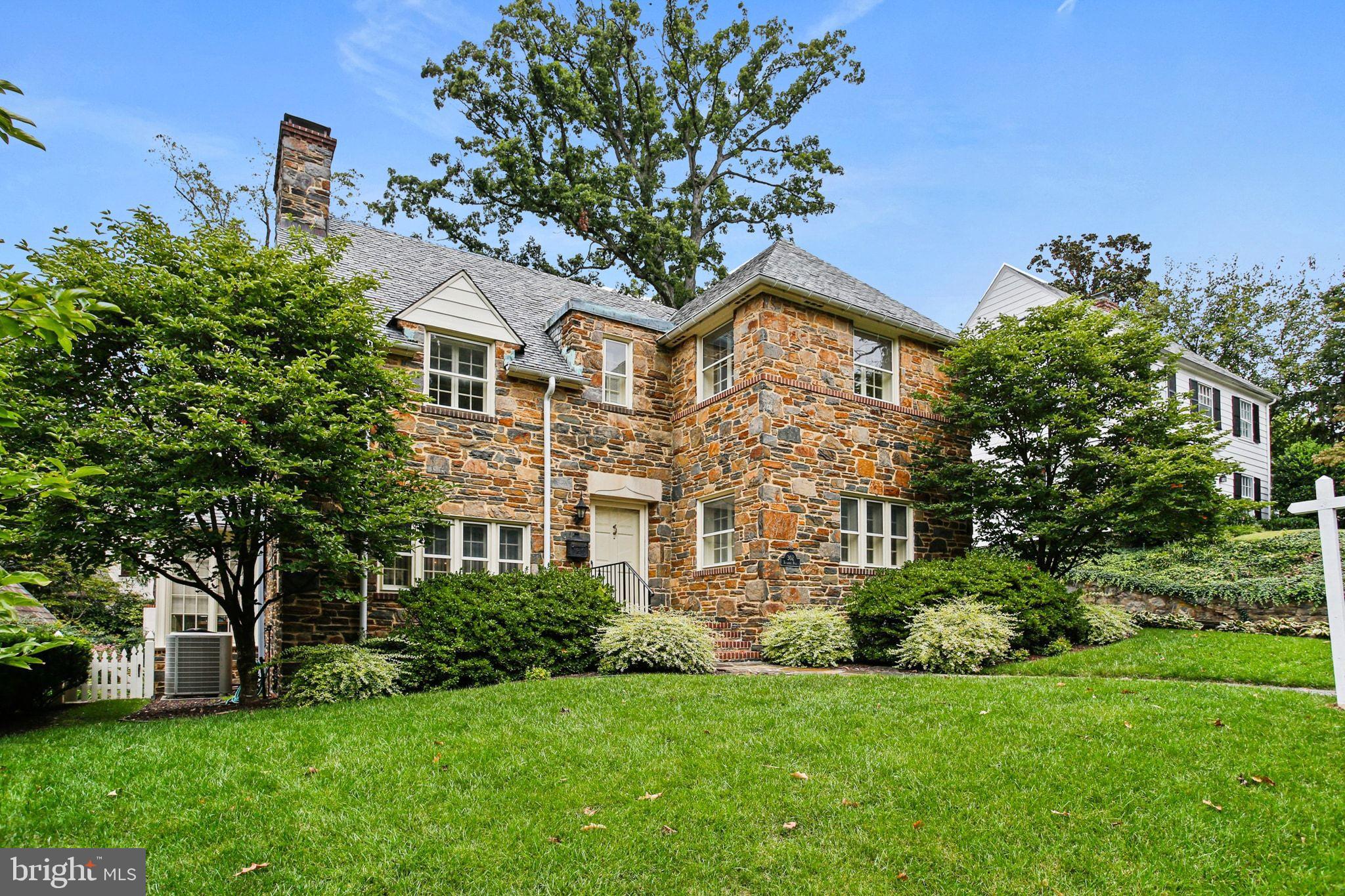 302 Tunbridge Road Baltimore, MD 21212 - Photo 3 of 77 Charming stone home with lush greenery.