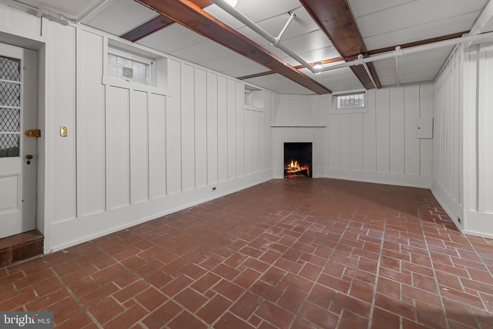 302 Tunbridge Road Baltimore, MD 21212 - Photo 42 of 77 Charming basement with rustic fireplace.