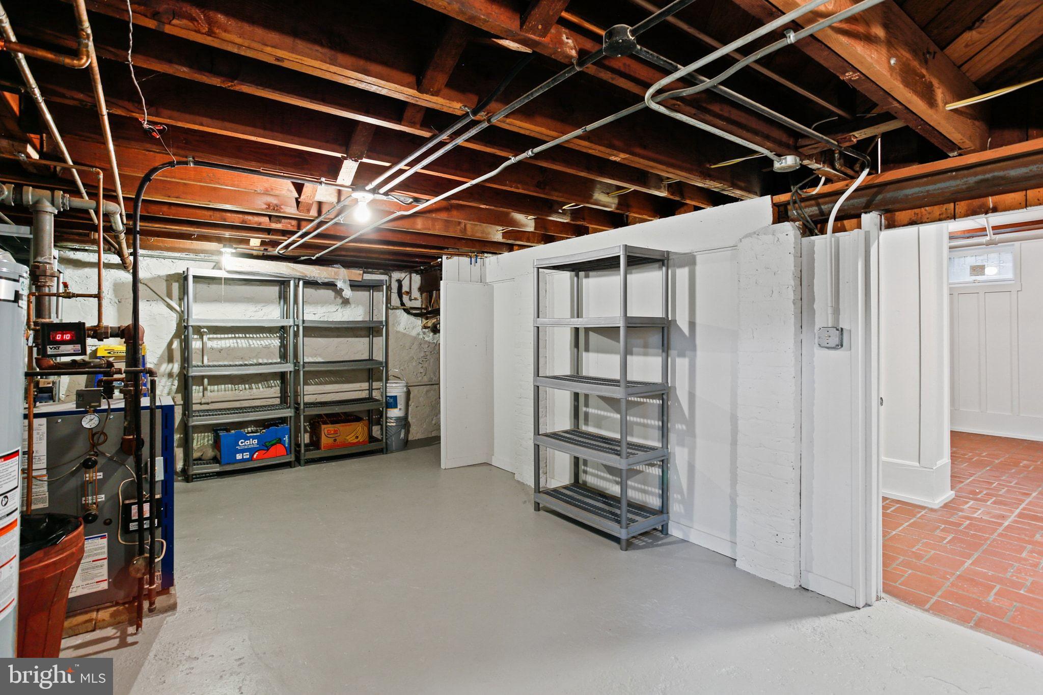 302 Tunbridge Road Baltimore, MD 21212 - Photo 53 of 77 Spacious basement with organized shelving.