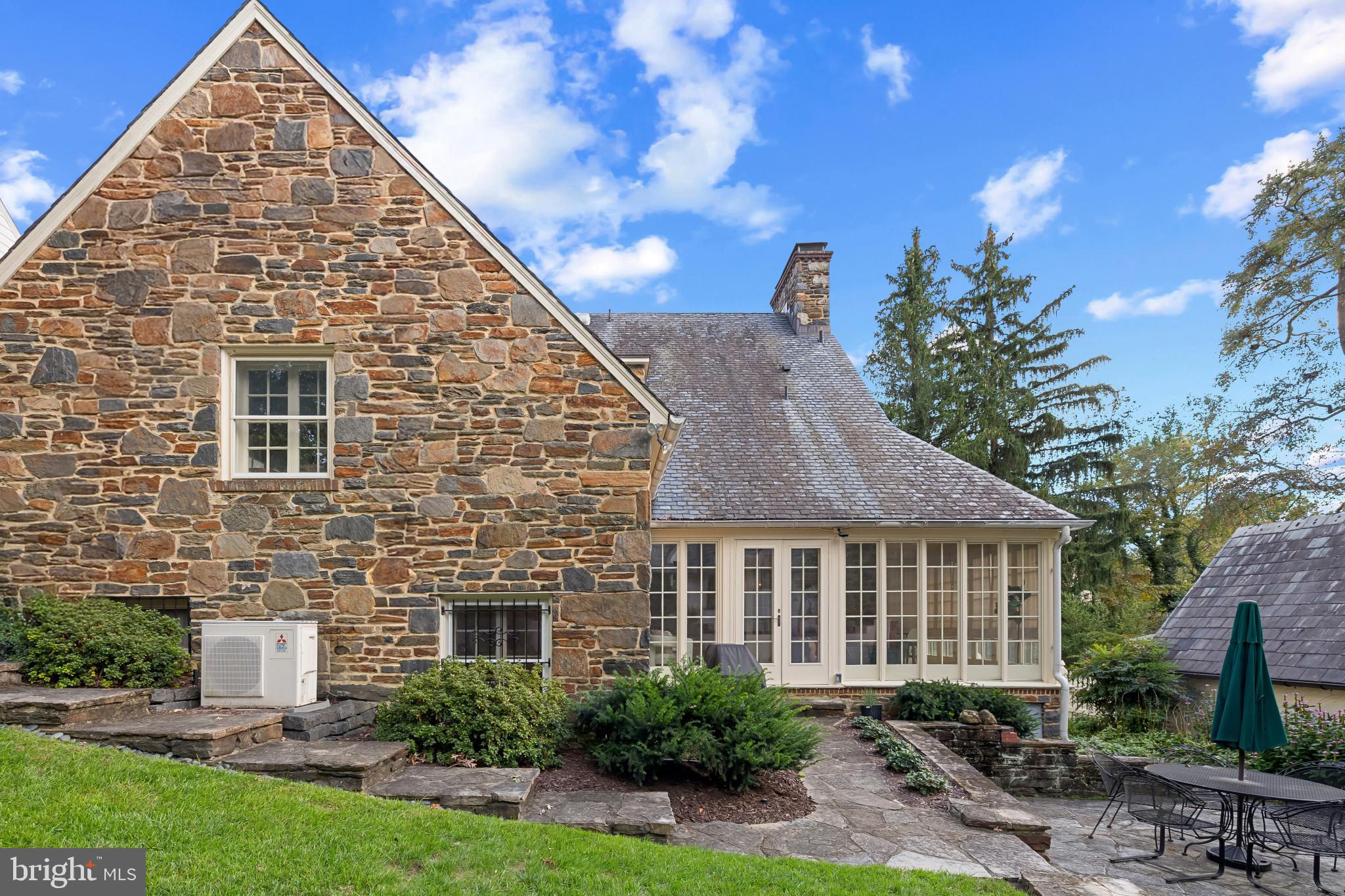 302 Tunbridge Road Baltimore, MD 21212 - Photo 73 of 77 Charming stone home with lush greenery.