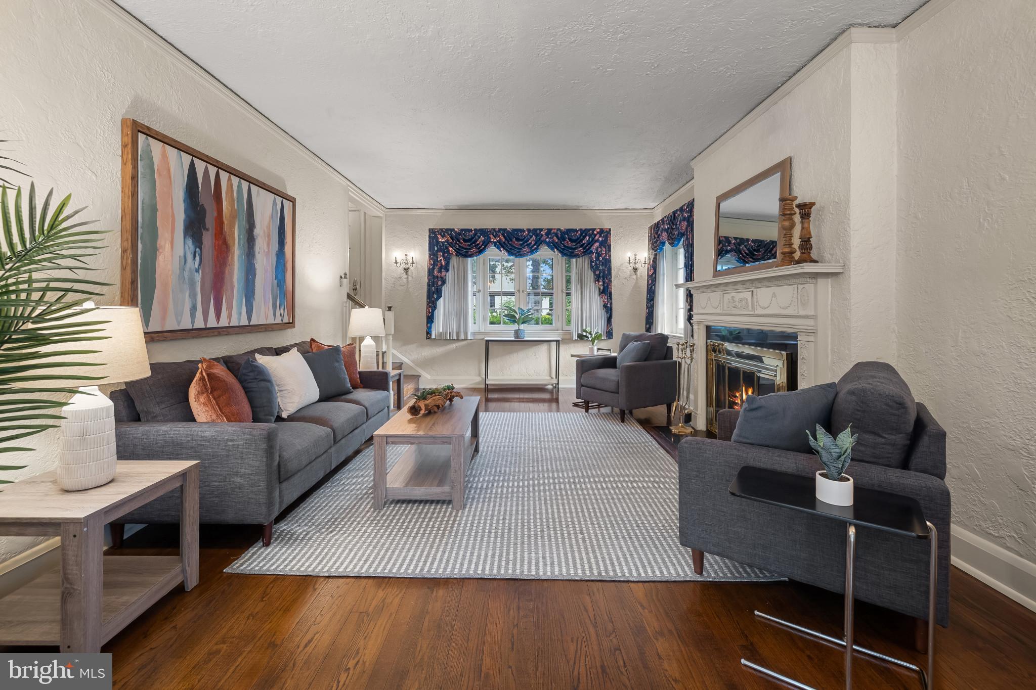 302 Tunbridge Road Baltimore, MD 21212 - Photo 9 of 77 a living room with furniture fireplace and window